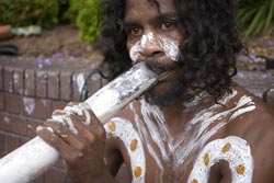 Aboriginal Australian playing didgeridoo